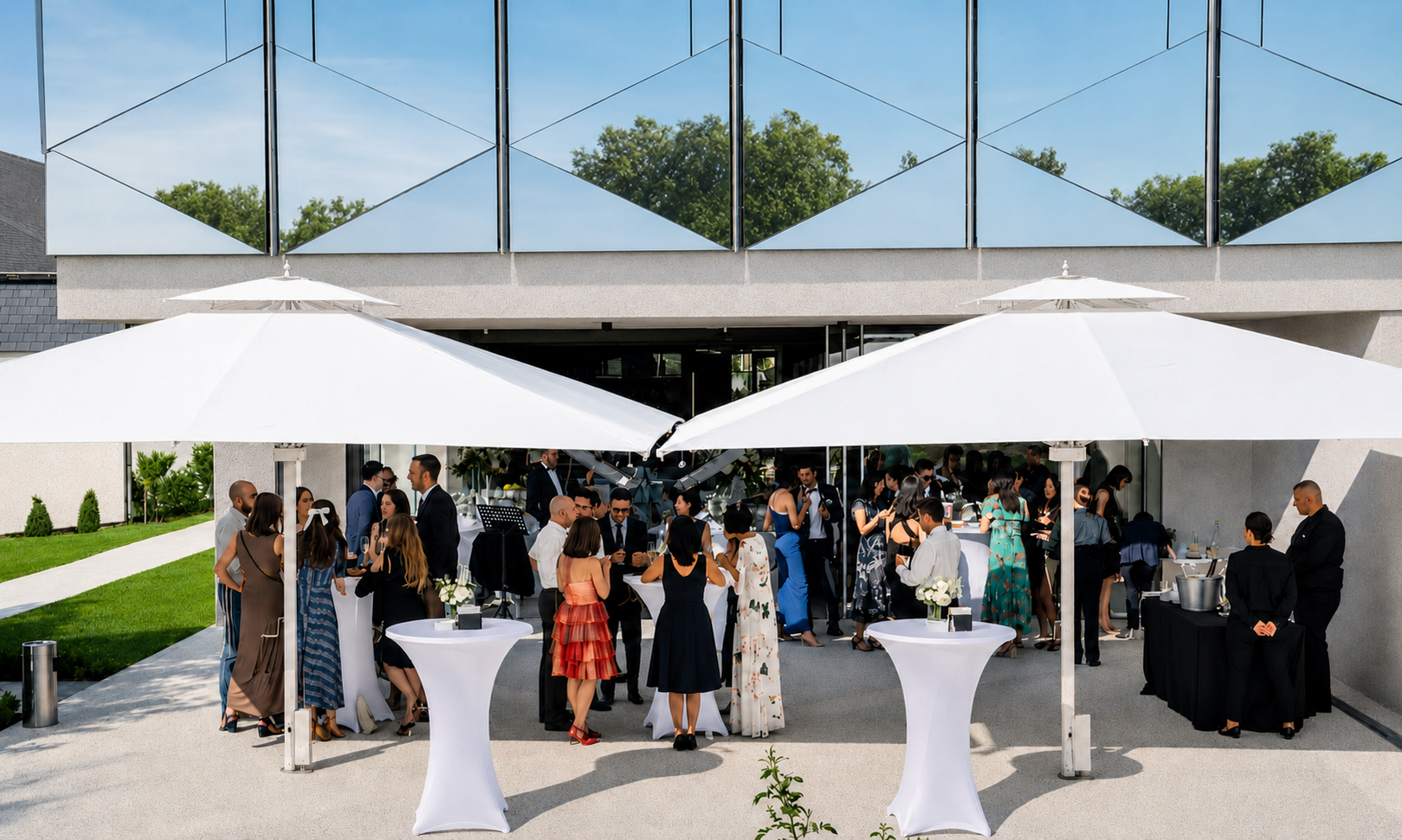Guests gathering on the green terrace of Domaine Claude Bentz in daylight